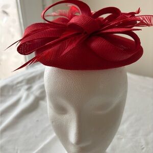 Vibrant Red Sculptural Hat with Bow and Feathers
